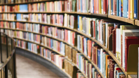 Images of books on shelves in a library