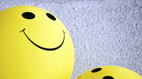 Smiley face yellow balloons